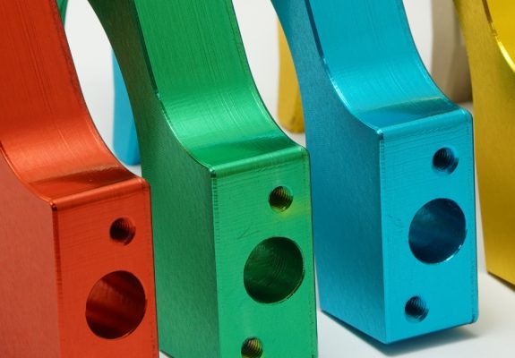 Coloured anodised aluminium precision components showing surface finishing options